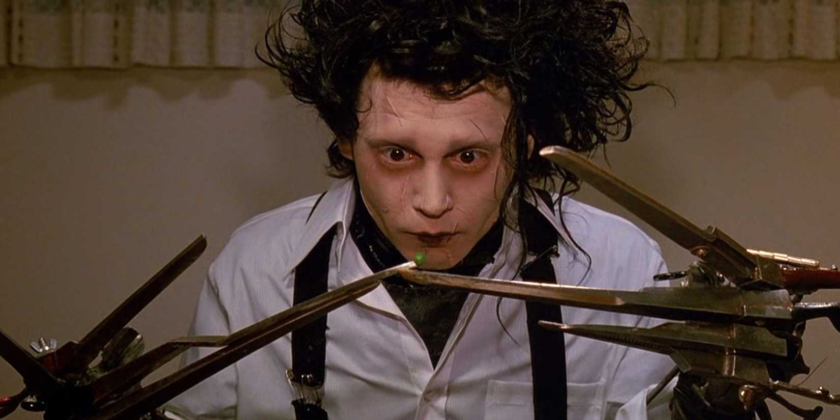 Johnny Depp as Edward balances a single pea on his long, sharp hands in Edward Scissorhands.