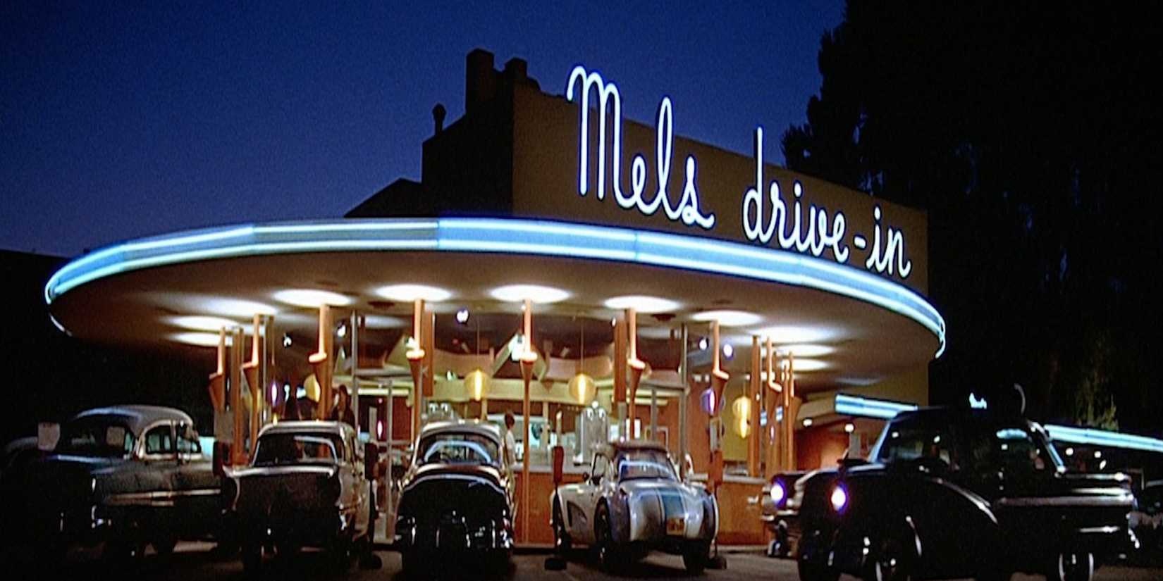 Cars parked at a 1970s drive-in in American Graffii
