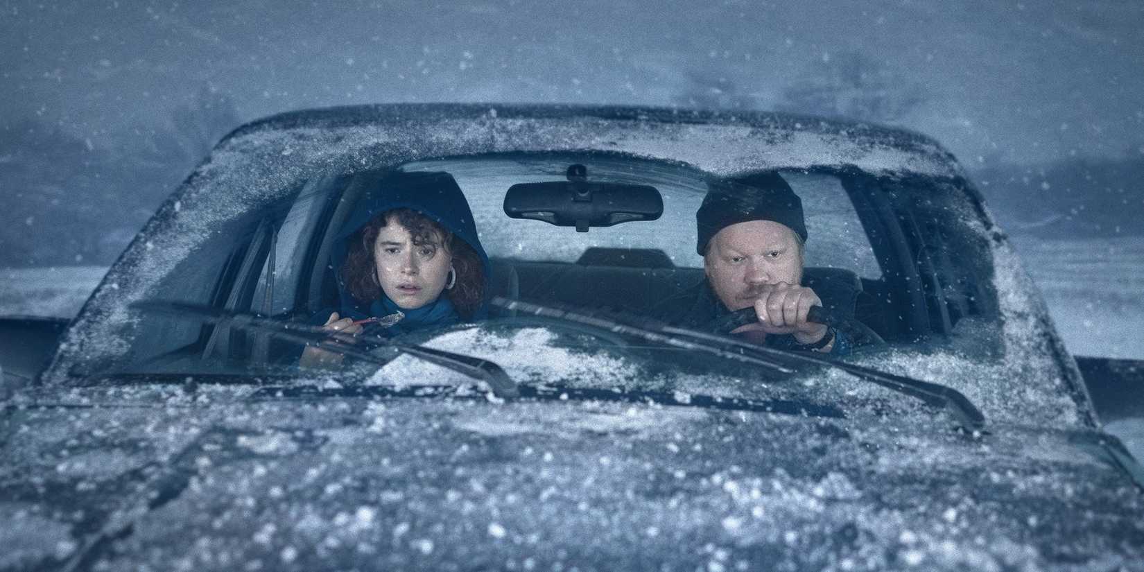 Lucy and Jake driving in the snowstorm to get to his parents' farm.