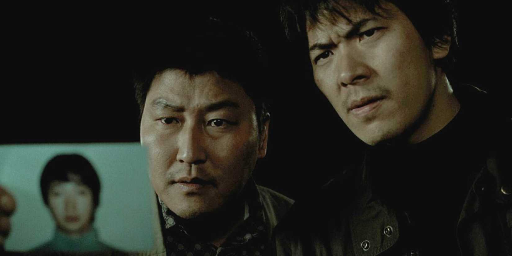Two detectives showing a photo in Memories of Murder