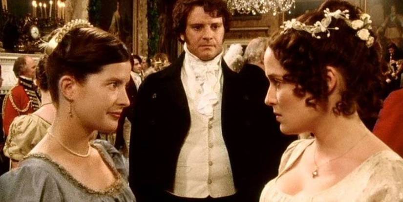 Mr. Fitzwilliam Darcy watches as Elizabeth Bennet talks to another woman in Pride and Prejudice