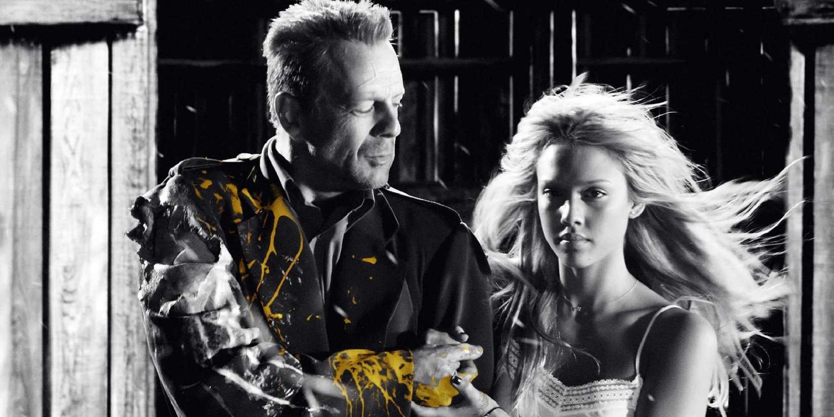 John Hartigan and Nancy walking out of a barn in Sin City.