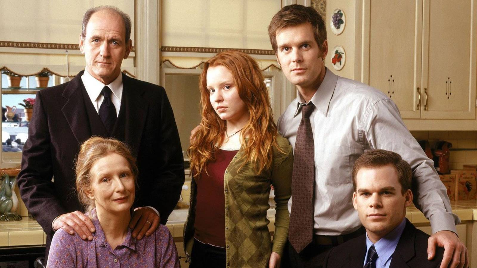 The Fisher family standing in a group in the kitchen in Six Feet Under