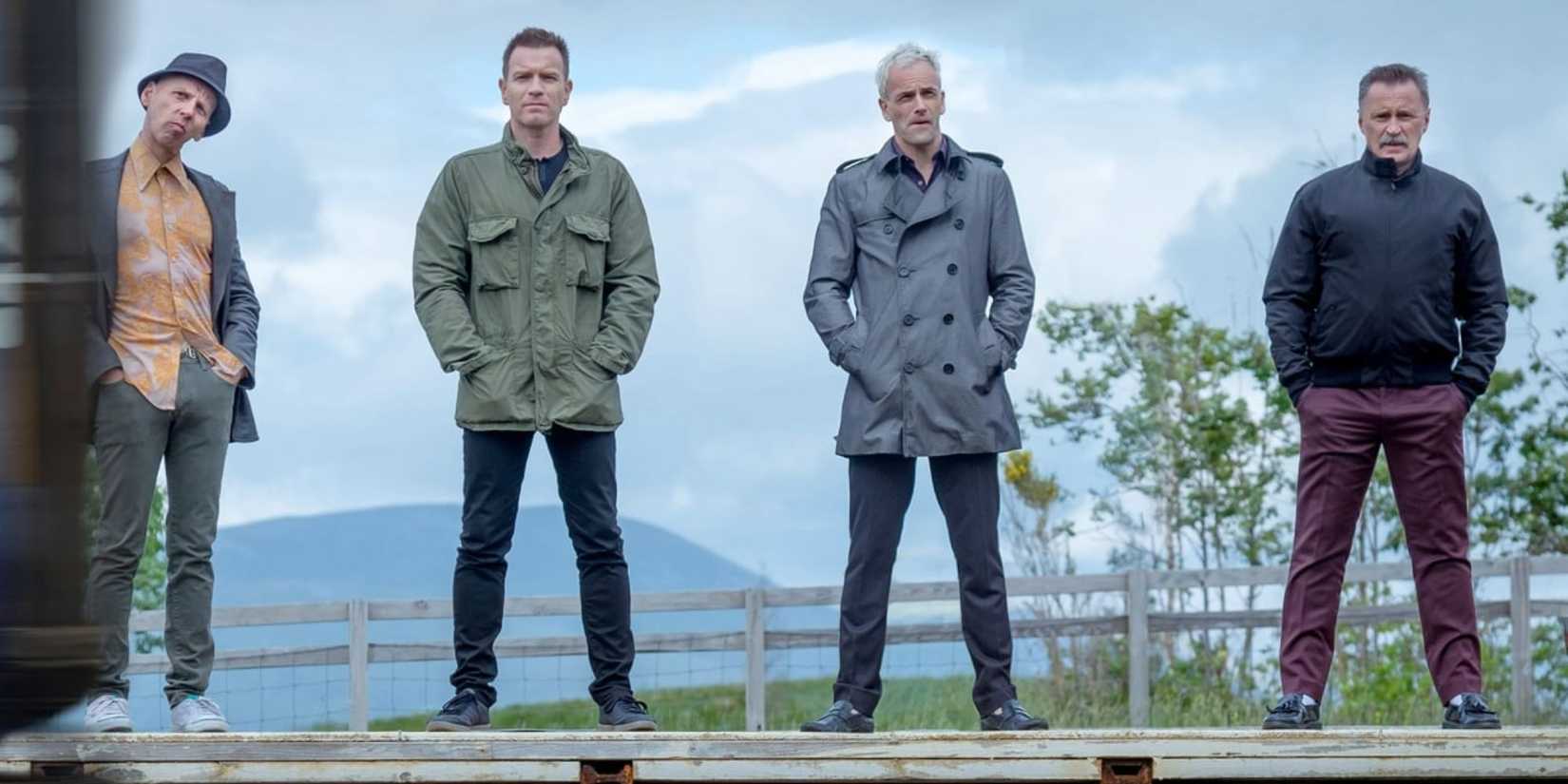 Spud, Rent Boy, Sick Boy, and Franco standing in line looking ahead in Trainspotting 2