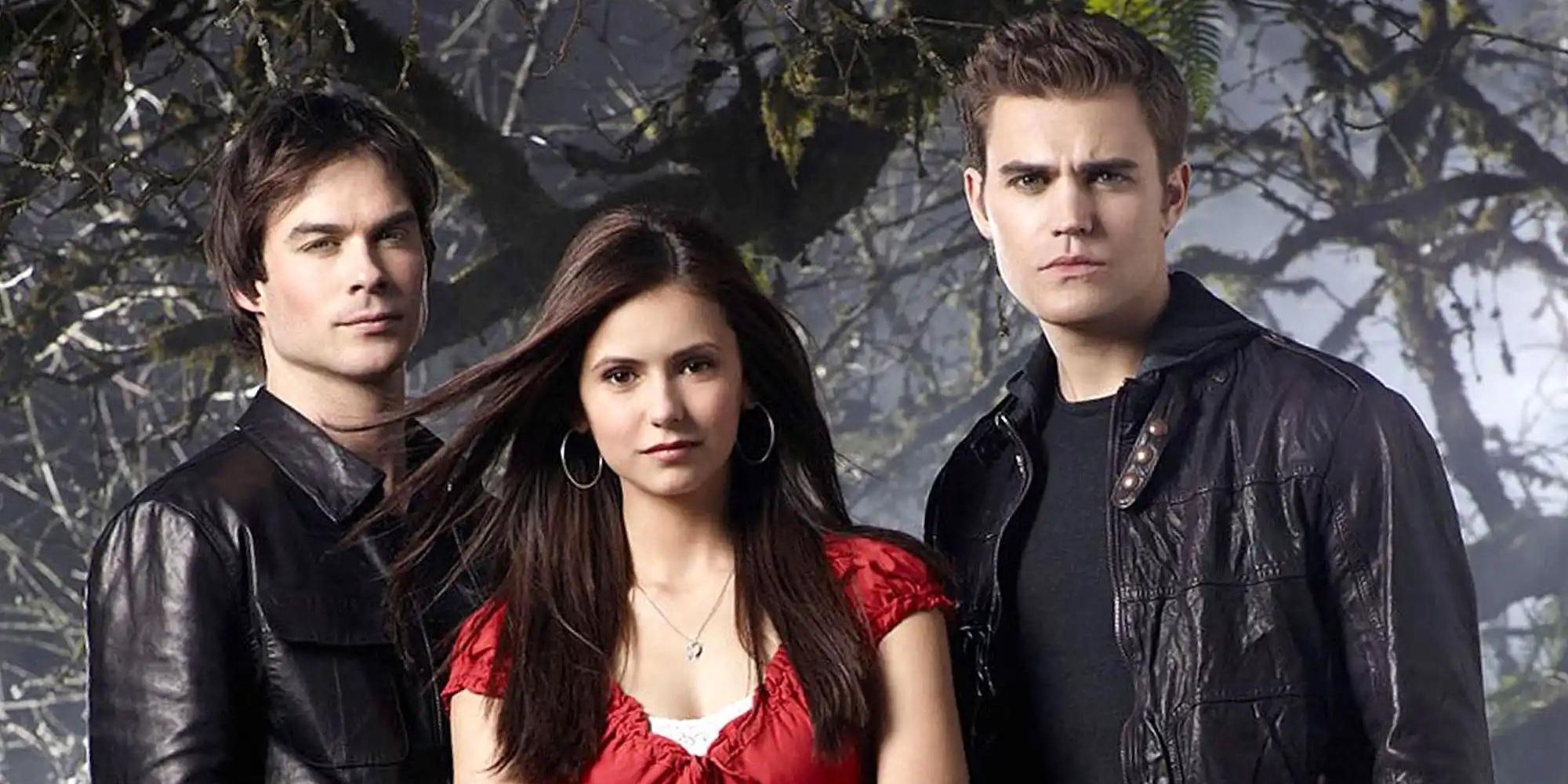 Elena, Damon and Stefan from The Vampire Diaries standing together in the woods