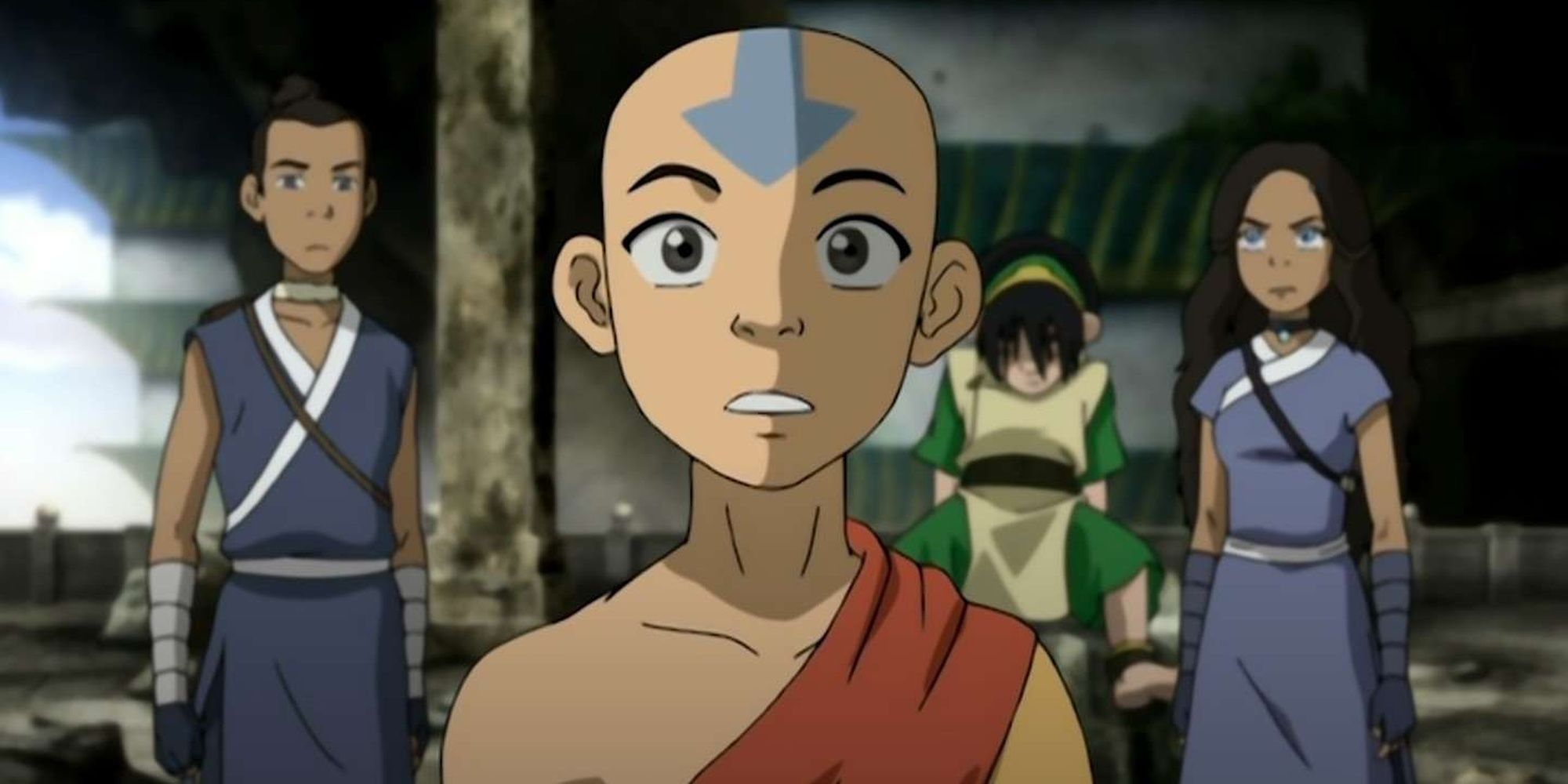 Avatar Aang stands with his friends at his back.