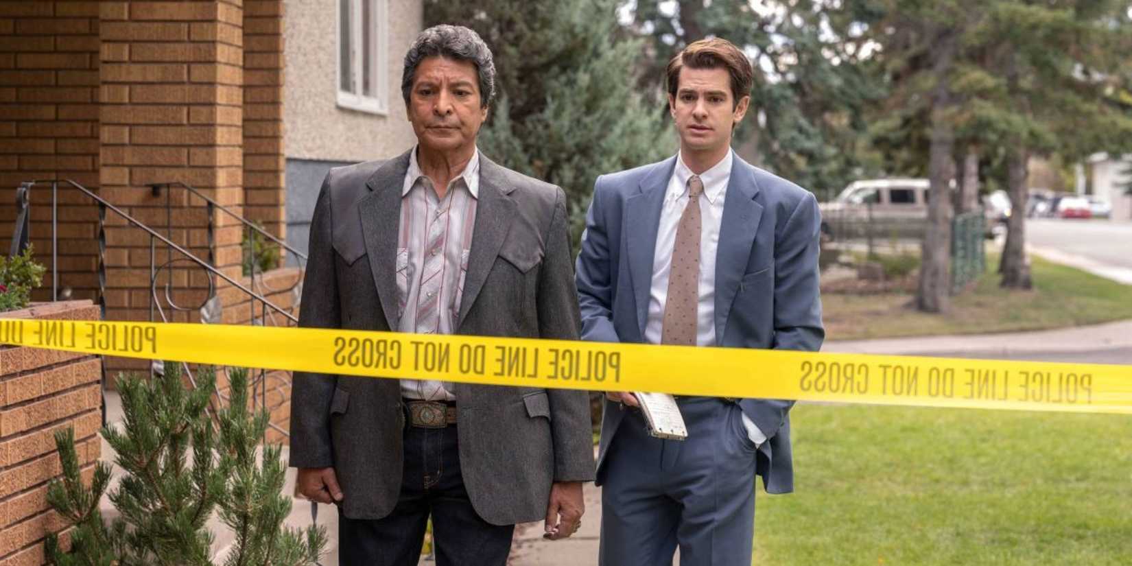 Two men approaching a crime scene Under the Banner of Heaven.
