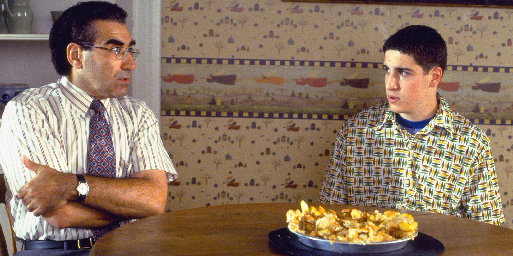 Jim's Dad and Jim talk at the kitchen table that holds a destroyed apple pie in American Pie.