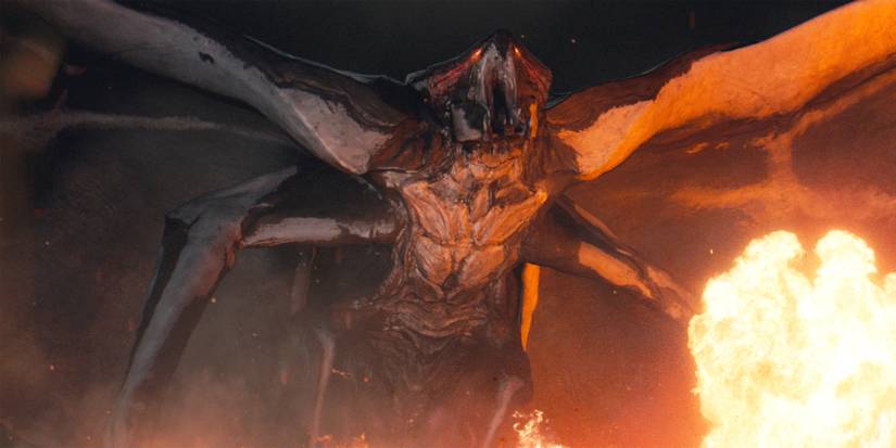 A MUTO roars behind an explosion in Godzilla (2014)