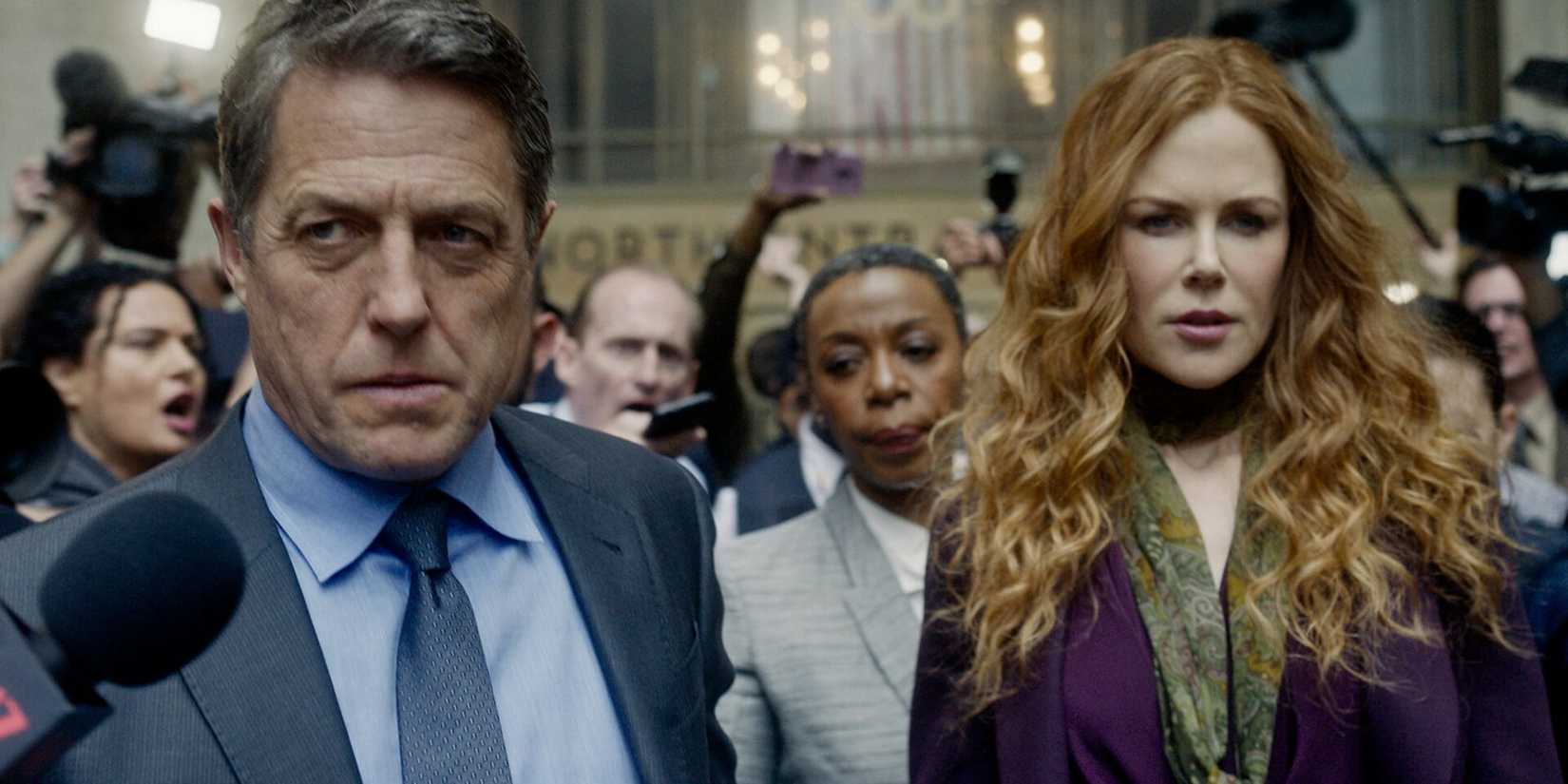 Hugh Grant and Nicole Kidman surrounded by the press in The Undoing.