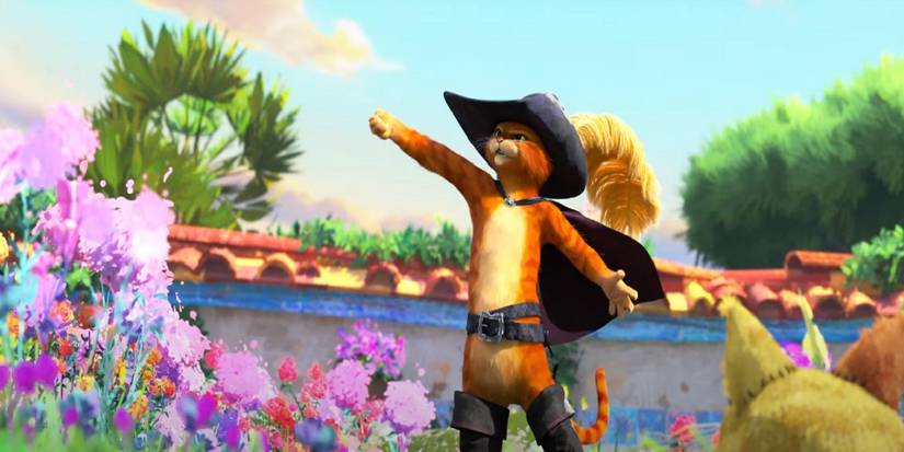 Puss raising his sword while standing in a garder in Puss in Boots: The Last Wish