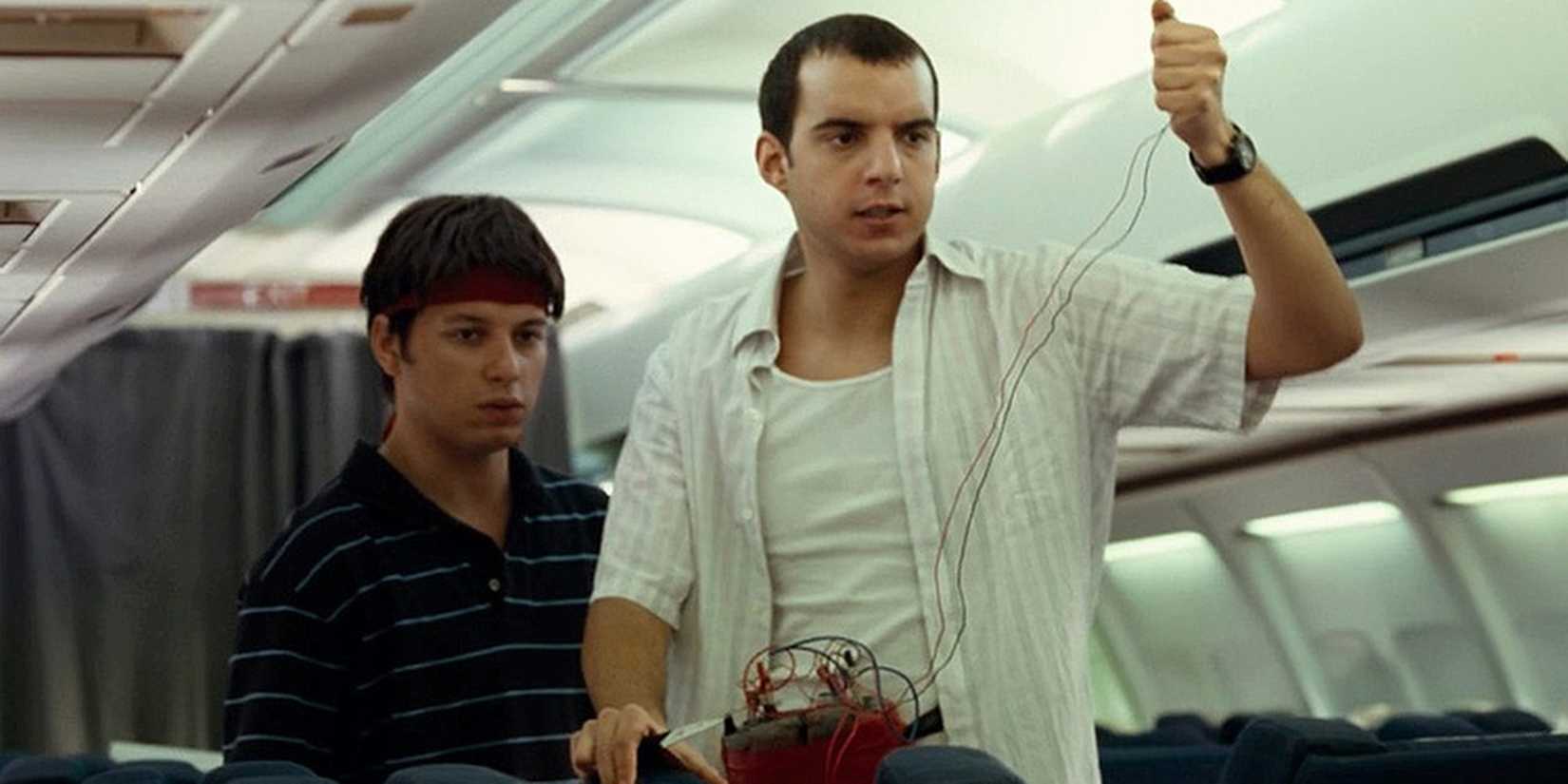 united 93 terrorist holds a bomb in a plane