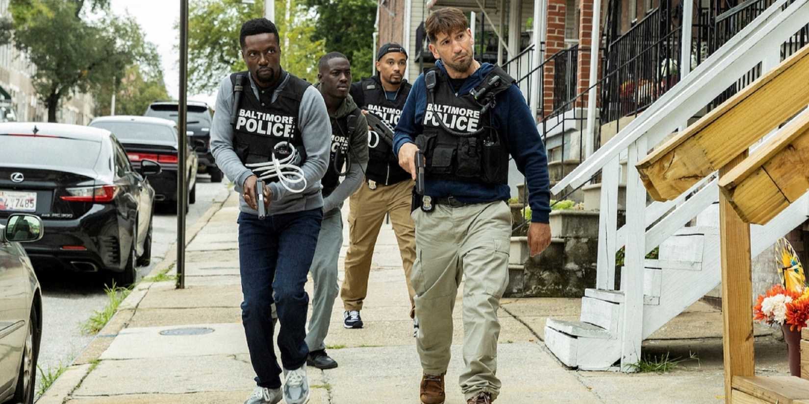 Officer Wayne Jenkins (Jon Bernthal) leading his Gun Task Force team down a sidewalk in 'We Own This City'.