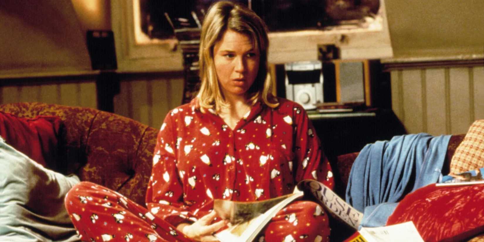 Bridget from Bridget Jones's Diary sitting on her couch