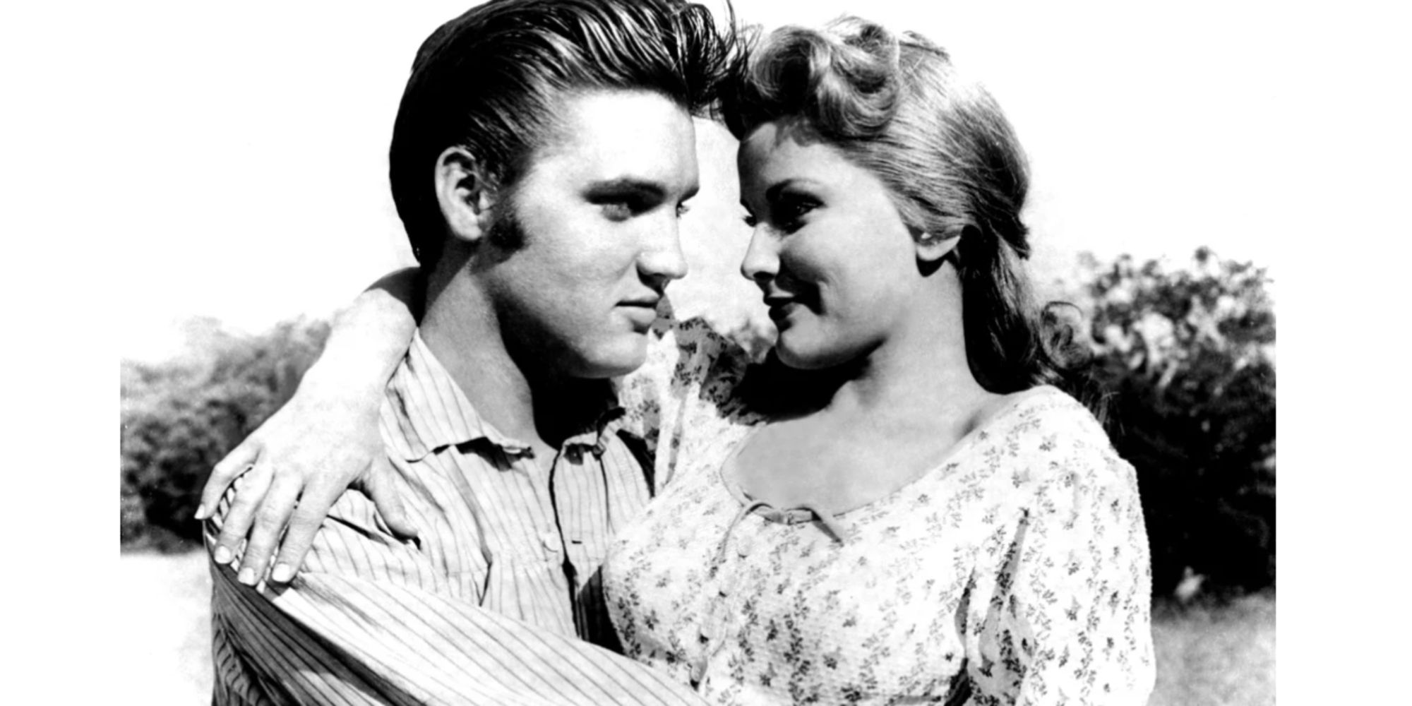 Elvis Presley hugging Debra Paget 