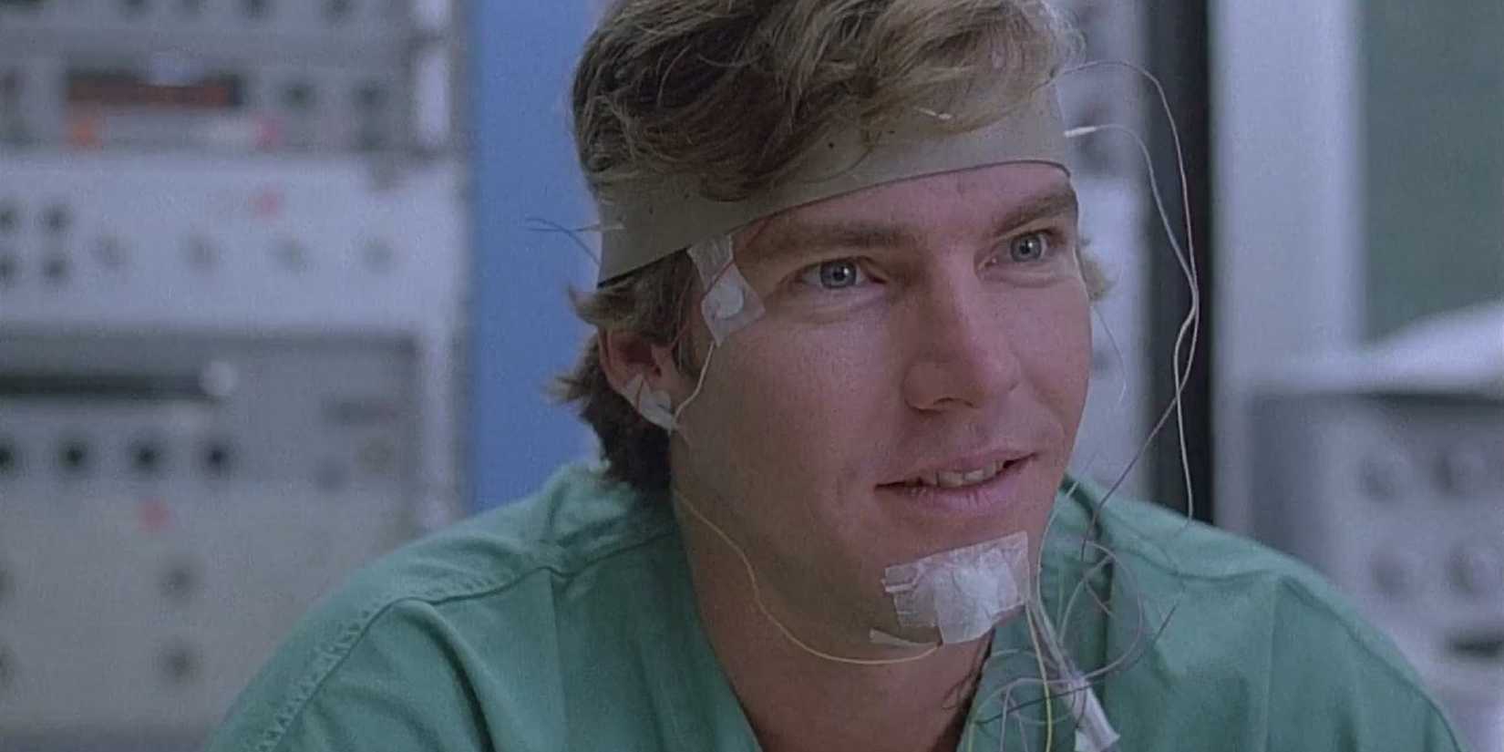 Alex in Dreamscape with medical wires on his face.