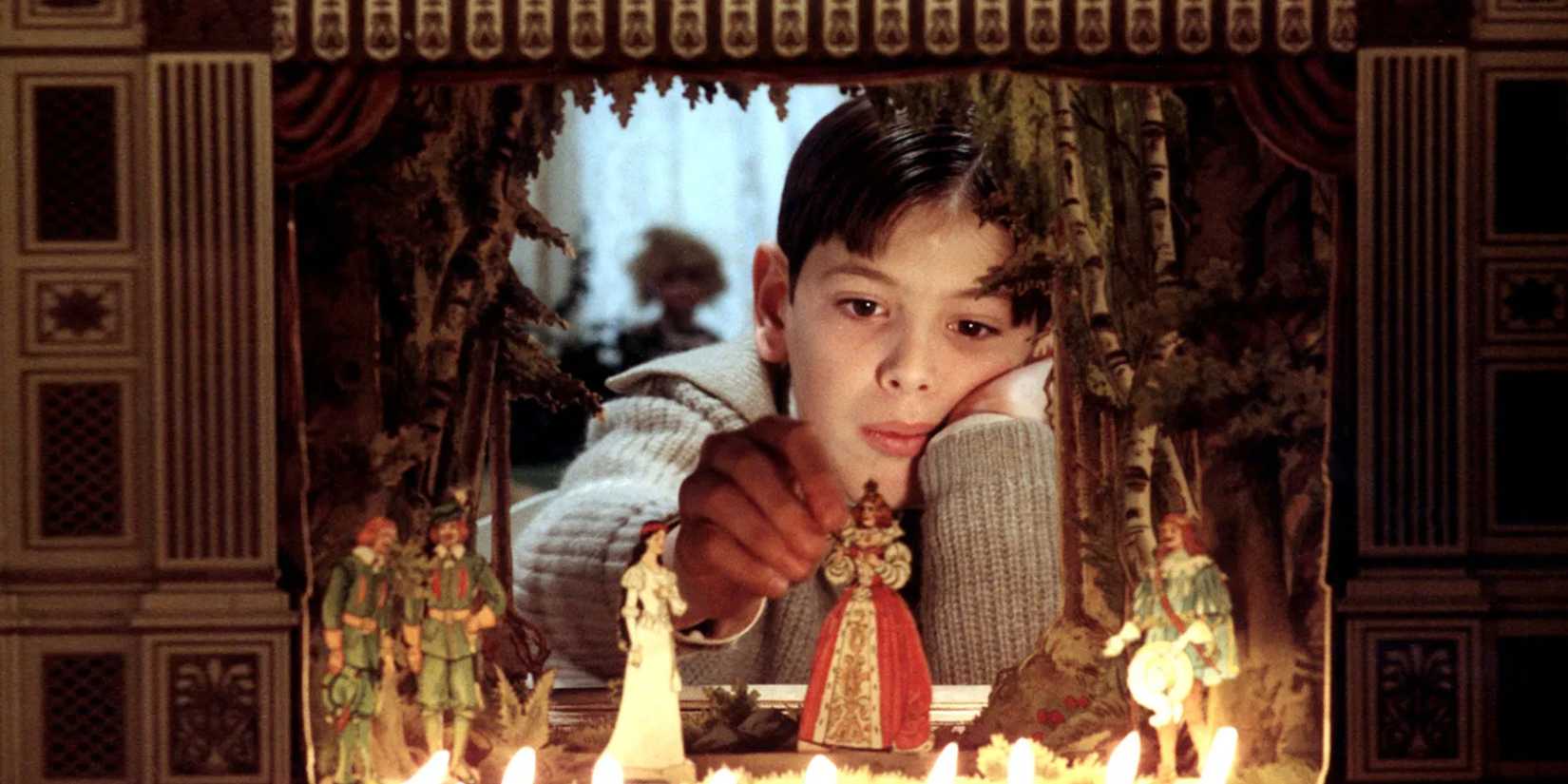 A boy playing with figurines in Fanny and Alexander