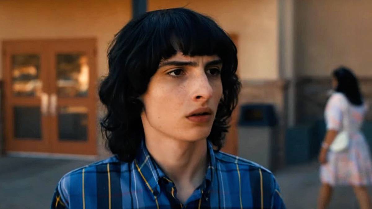 Finn Wolfhard as Mike Wheeler looking shocked in Stranger Things