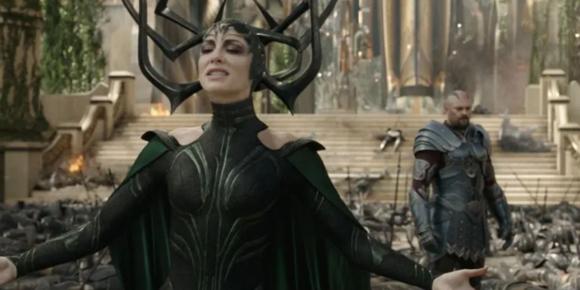 Cate Blanchett as Hela standing with her arms extended