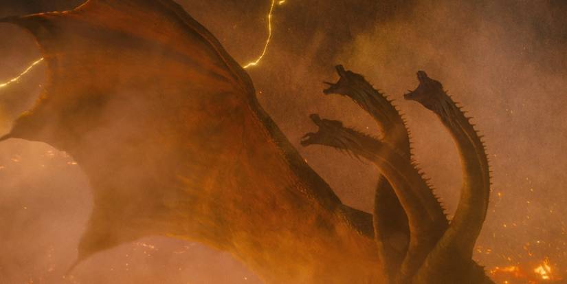 Ghidorah's three heads screeching into the sky with fog and lightening surrounding him