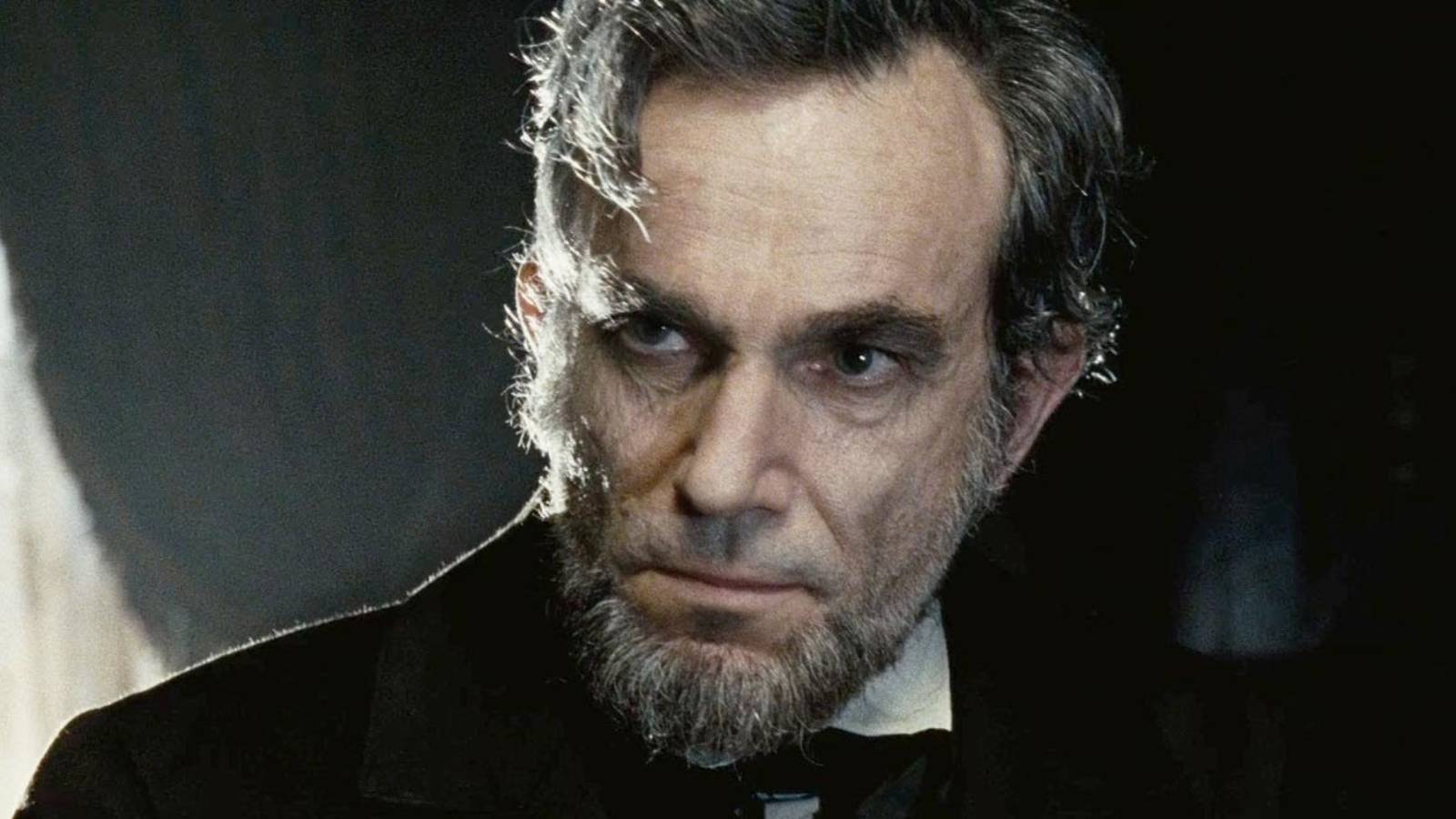 Daniel Day-Lewis as Abraham Lincoln looking intently at something off-camera in Lincoln.
