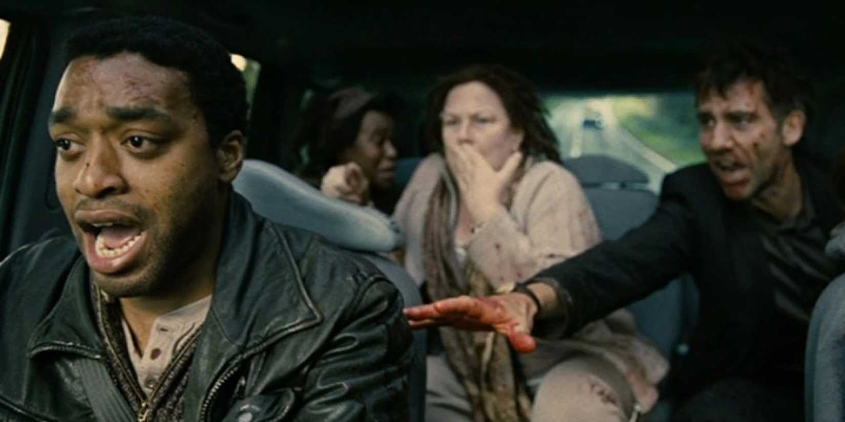 A group of desperate people inside a car in Children of Men