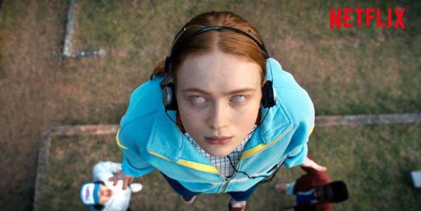 Stranger Things max listening to music while floating in the air