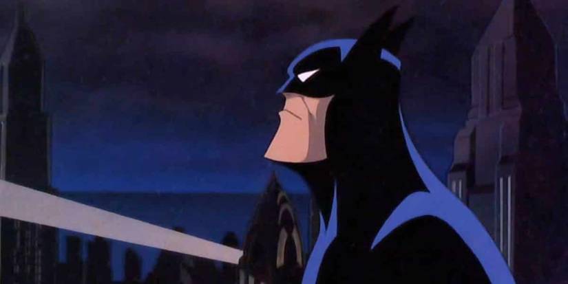 Batman in profile looking up at nighttime from Batman: The Animated Series