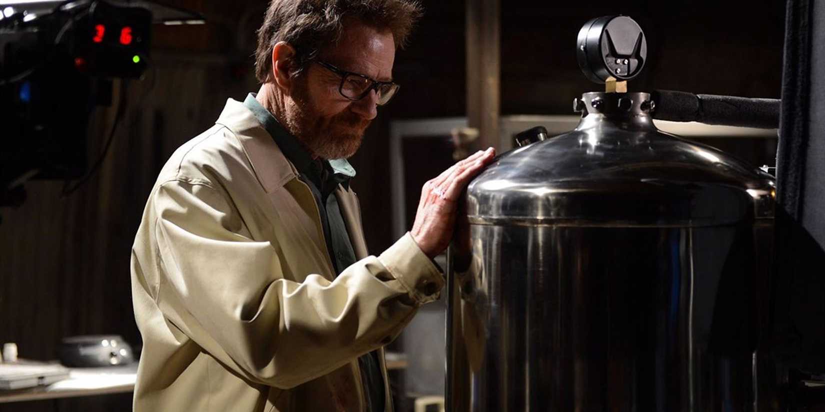 Walter White exploring his old lab, touching a metal tank in Breaking Bad.