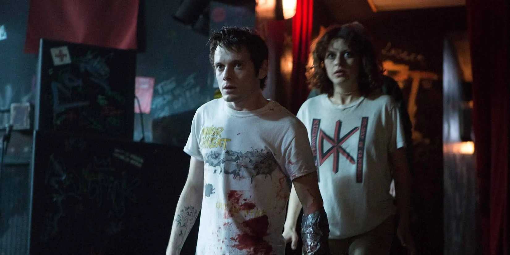 Pat (Anton Yelchin) and Sam (Alia Shawkat) standing in the bar in 'Green Room'