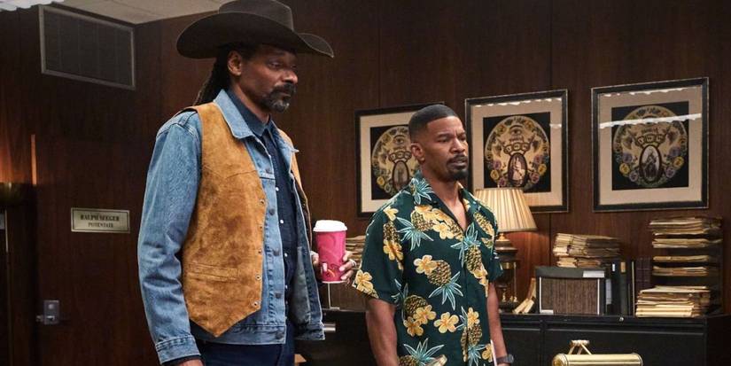 Snoop Dogg and Jamie Foxx are looking ahead in an office in Day Shift.