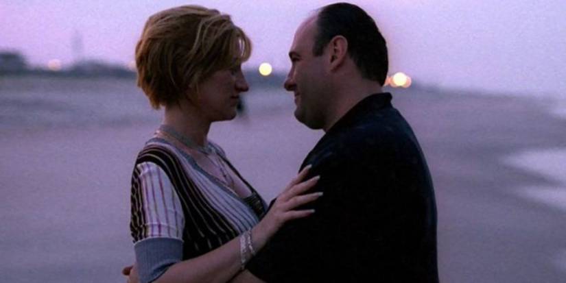 Carmela and Tony embracing on the beach in The Sopranos.