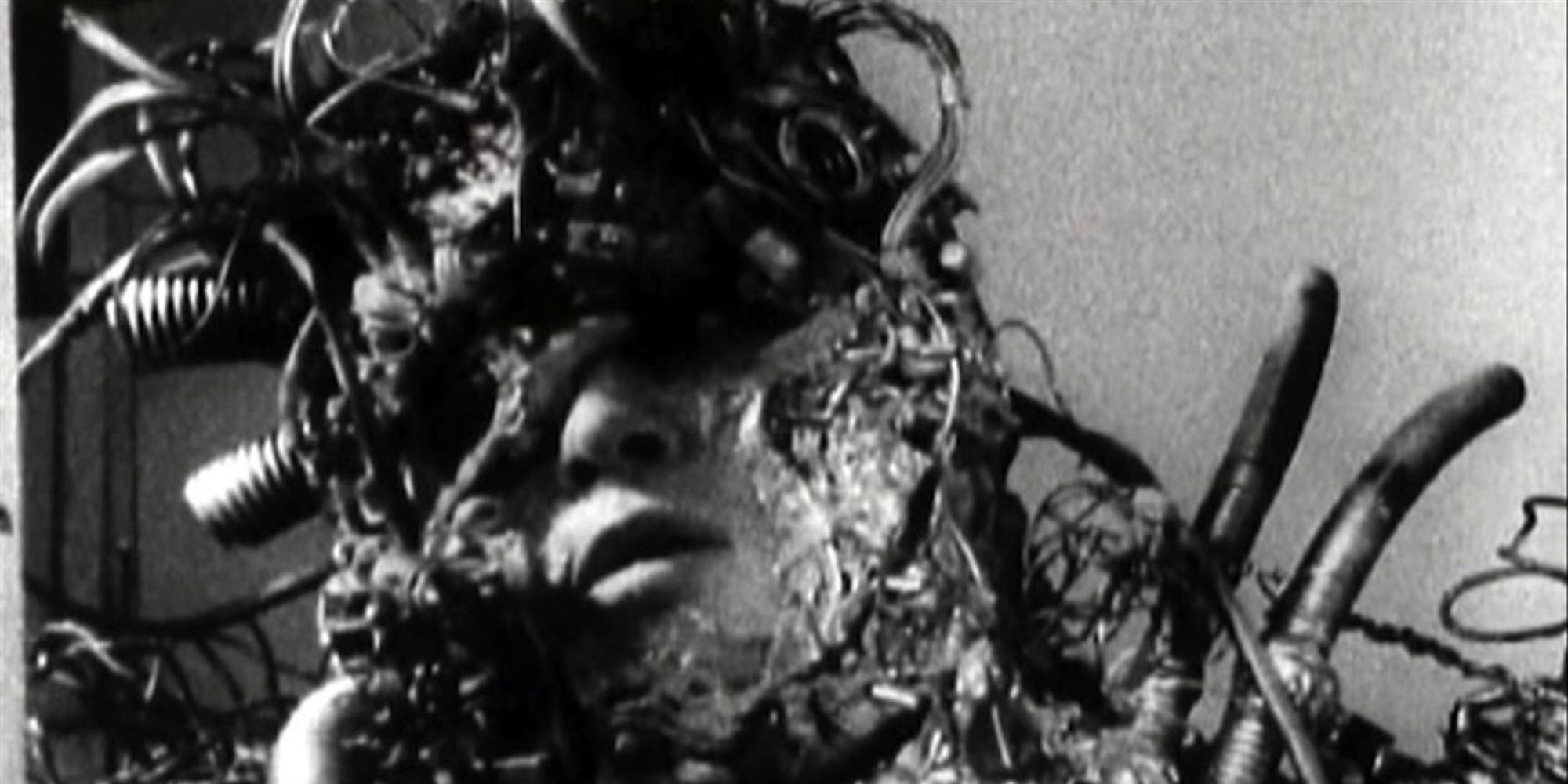 A man with wires coming out of him in  Tetsuo the Ironman