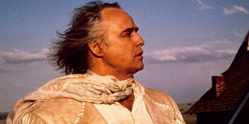 Marlon Brando looks off camera as Lee Clayton with the wind blowing his hair back in 'The Missouri Breaks'