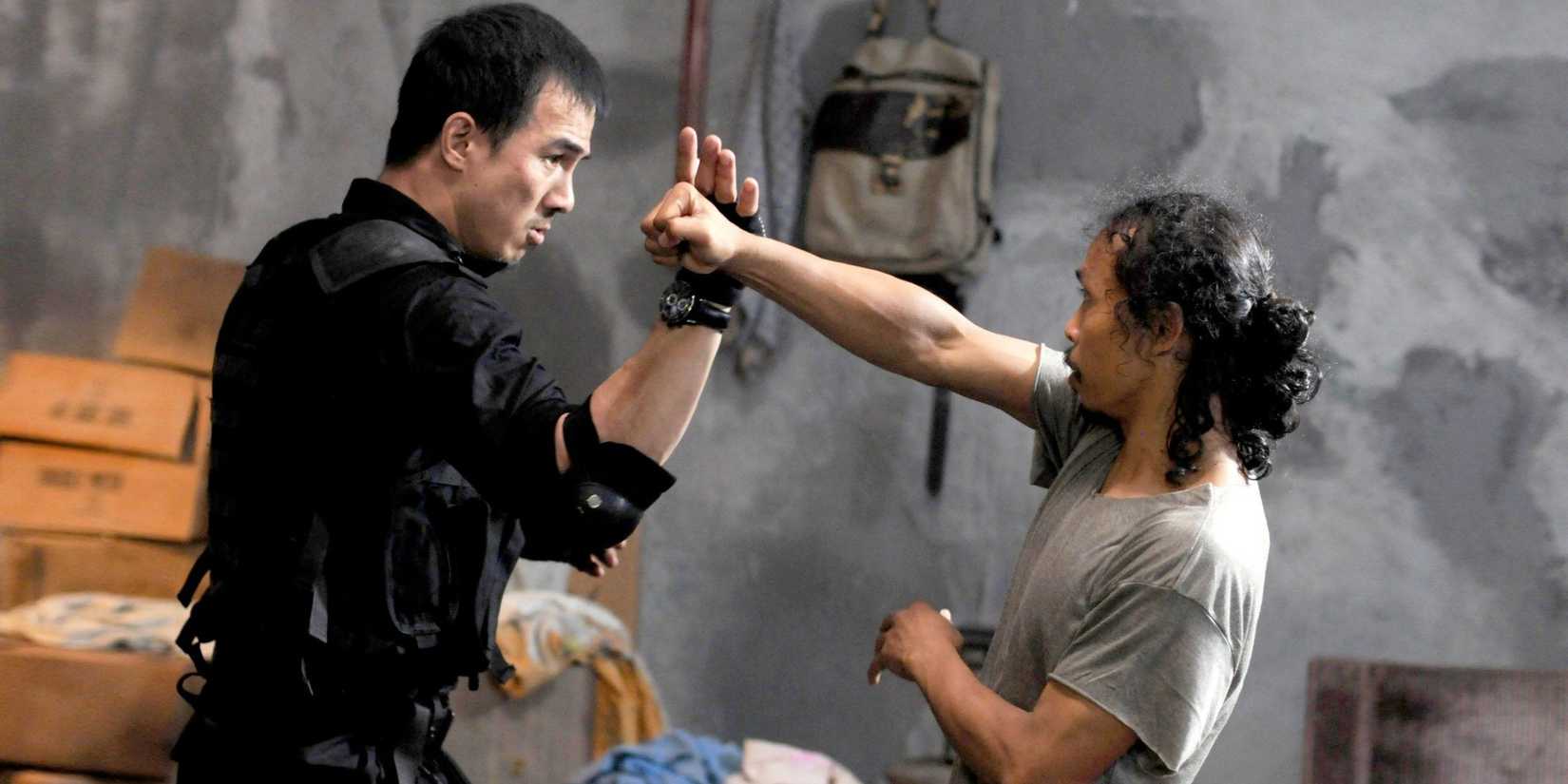 Two men exchanging blows in Gareth Edwards' 'The Raid: Redemption' (2011).
