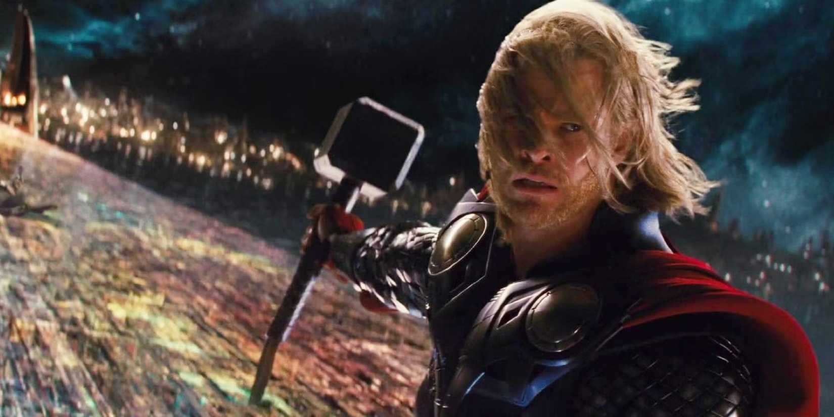 Thor on the Bifrost holding Mjolnir and looking back while wind blows his hair in Thor 2011