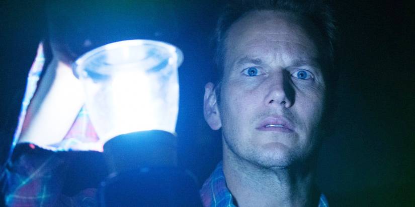Patrick Wilson holding up a lantern in Insidious: Chapter 2