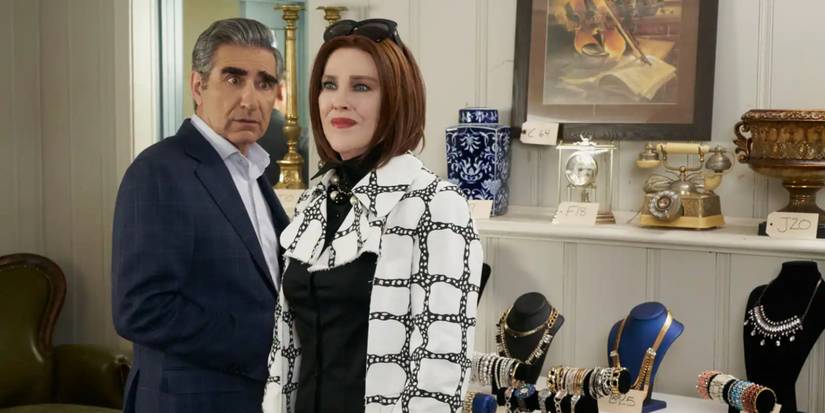 Johnny and Moira at a store looking confused in Schitt's Creek