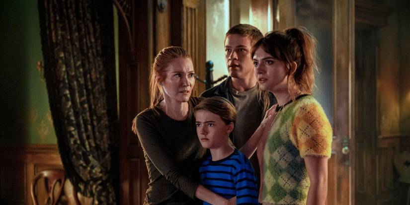 The Locke family looking off screen in worry in the Locke & Key series.