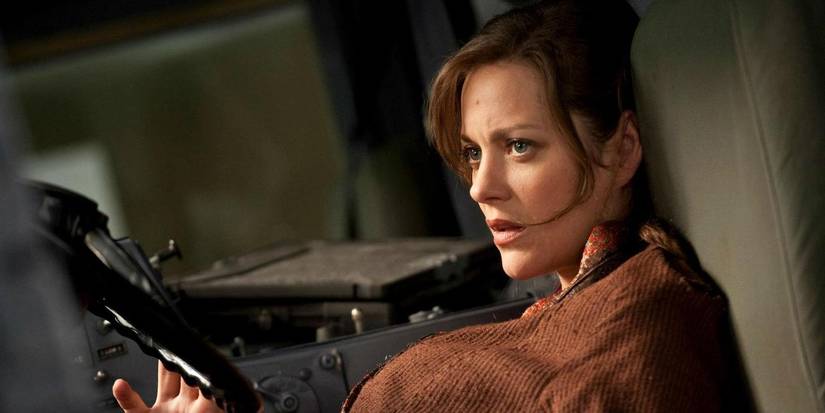 Talia Al Ghul in the front of a truck looking at someone in The Dark Knight Rises
