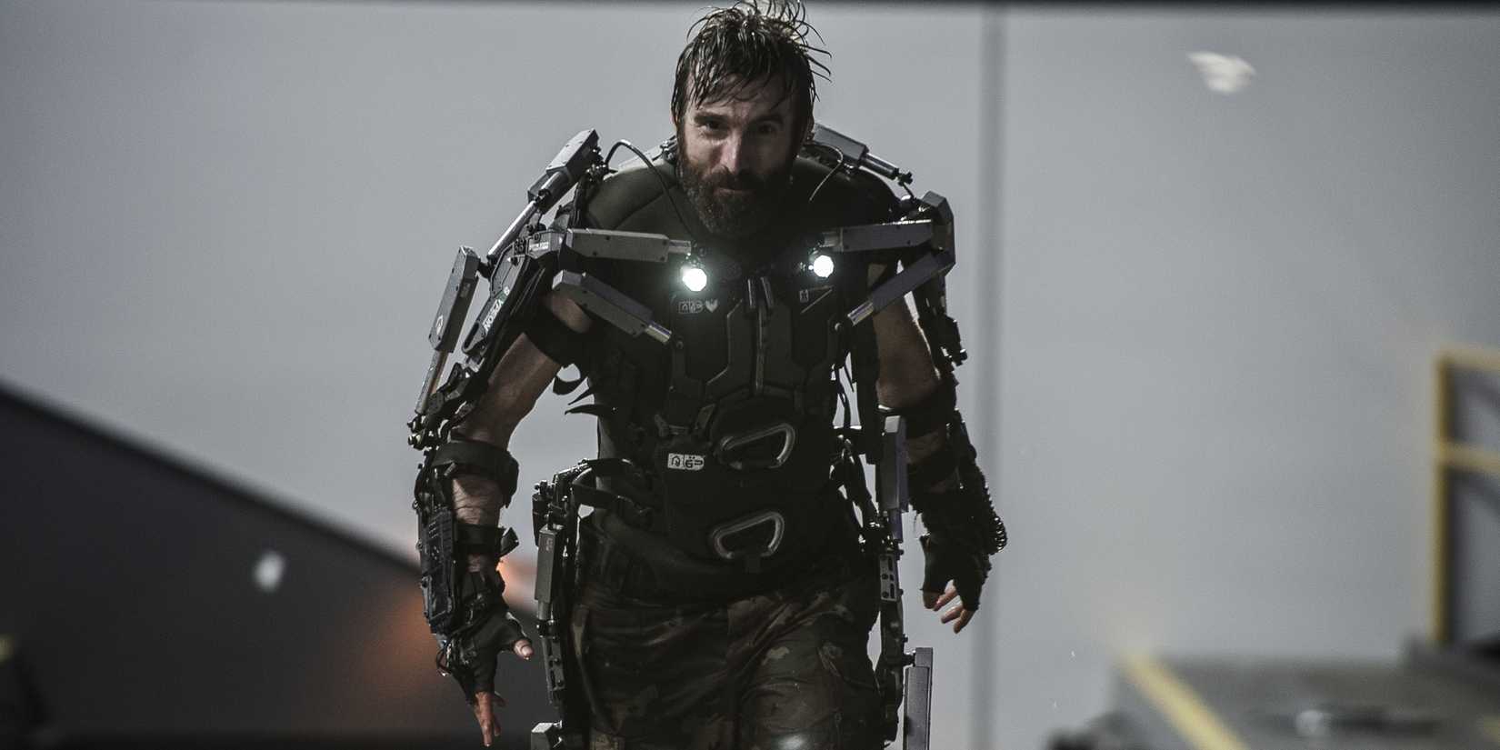 A man in power armour walking towards the camera