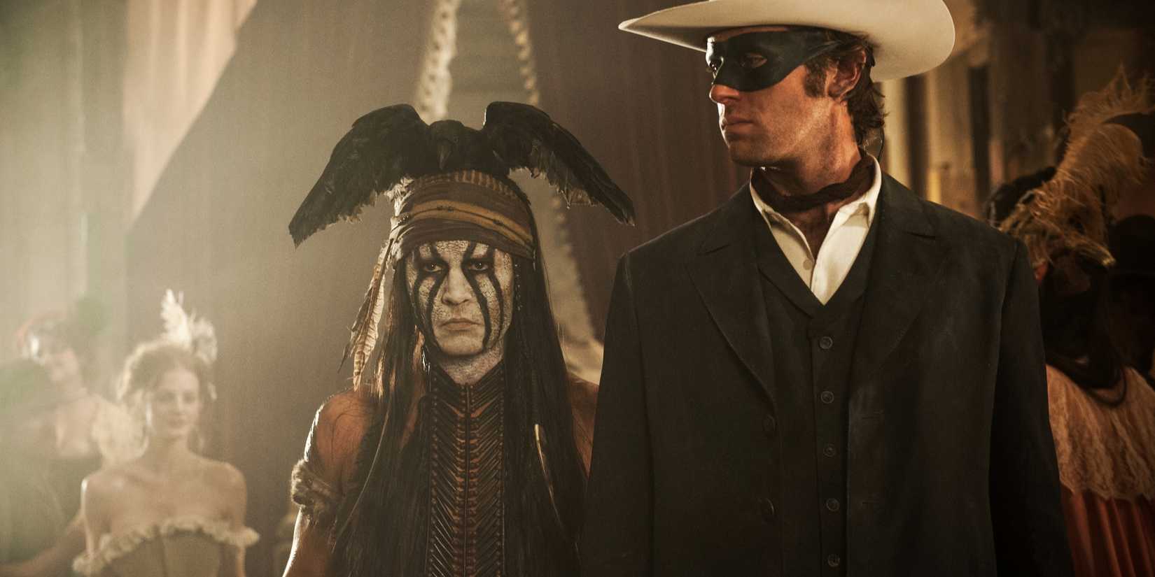 Tonto and The Lone Ranger walking into a saloon in The Lone Ranger