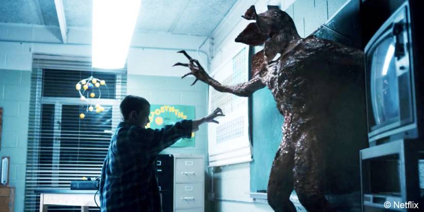 Stranger Things' Eleven pins the Demogorgon to the wall in the Hawkins Middle School at the end of Season 1.
