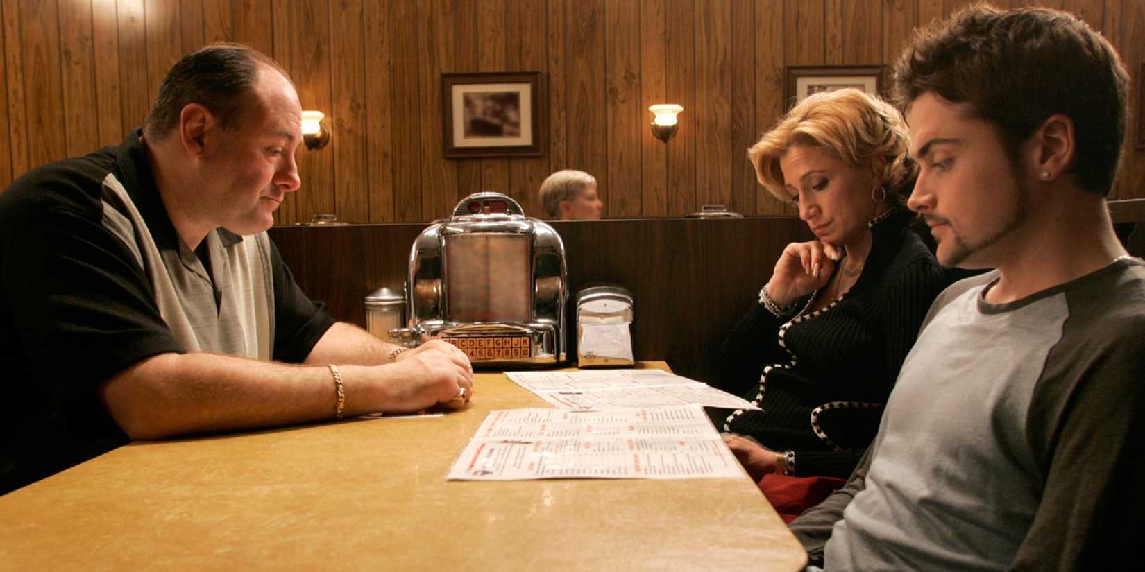 Tony Soprano sitting across from Carmela and Anthony Jr. in The Sopranos - Made in America.