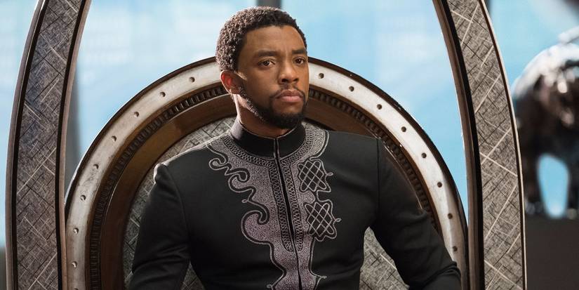 Chadwick Boseman as Black Panther sitting on the crown
