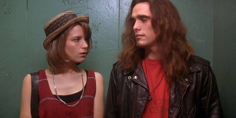 Bridget Fonda as Janet and Matt Dillon as Cliff look at each other in Singles (1992).