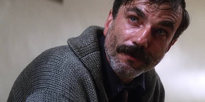 Daniel Day-Lewis as Daniel Plainview in a church looking ahead in There Will Be Blood
