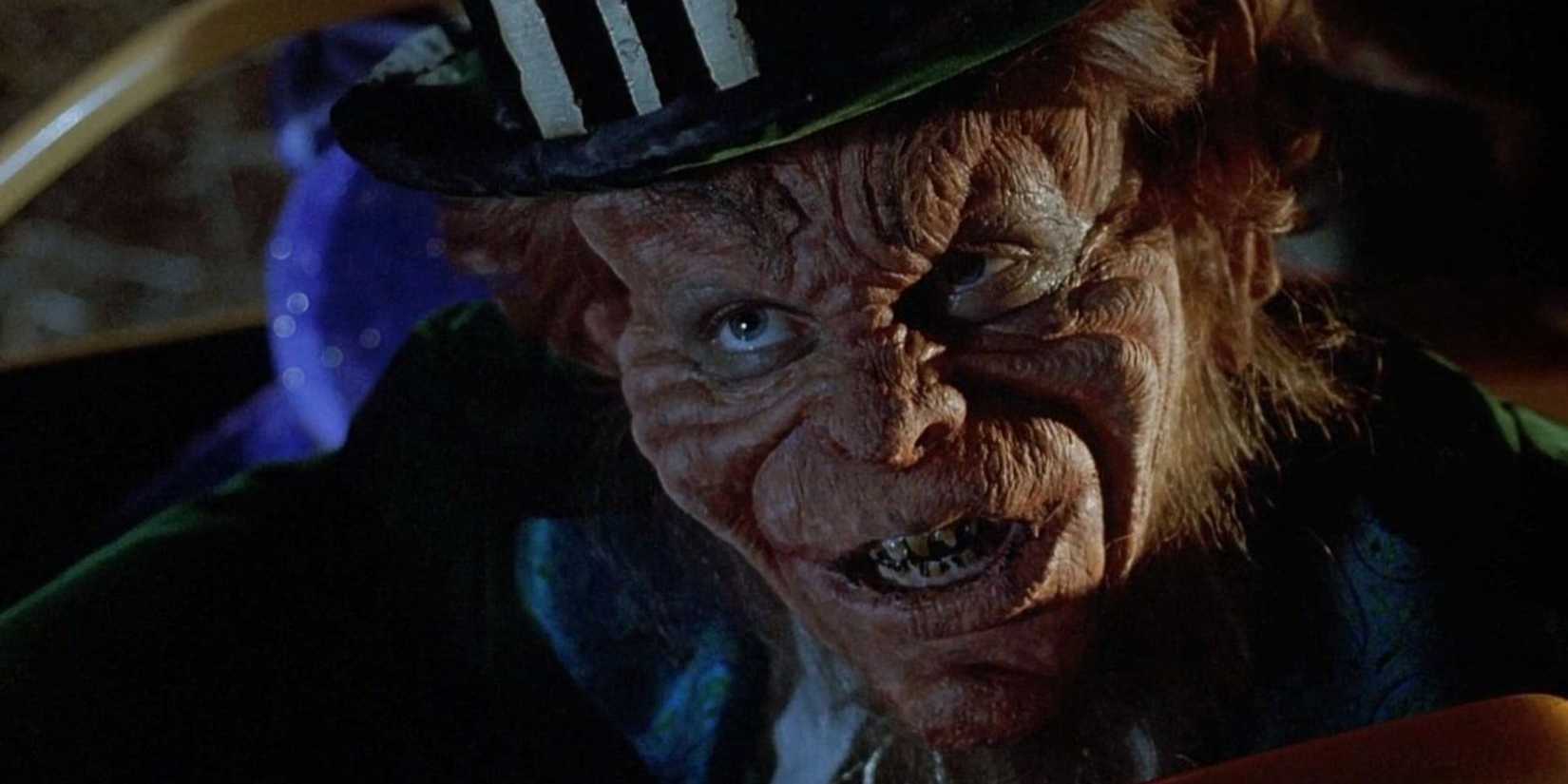 90s horror Leprechaun staring at the camera with a green hat on in Leprechaun 5: In the Hood.