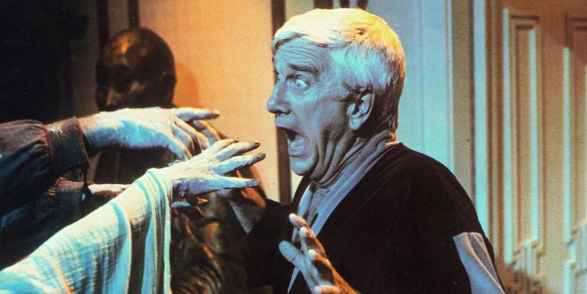 Leslie Nielsen, screaming, freaking out, surrounded by hands in Creepshow