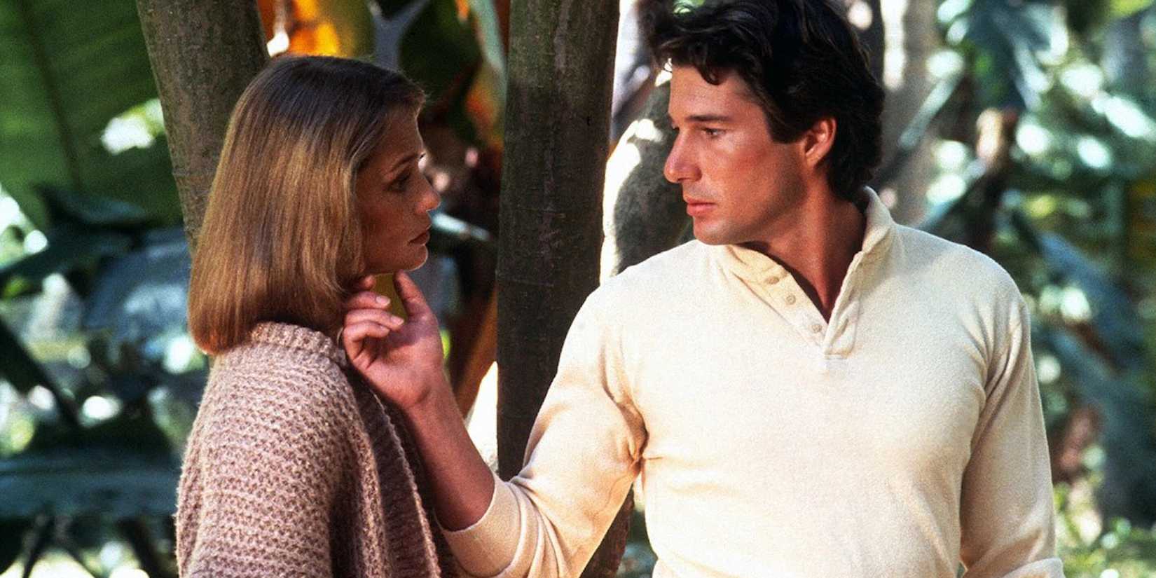 Richard Gere as Julian holds the chin of Lauren Hutton as Michelle tenderly in American Gigolo.